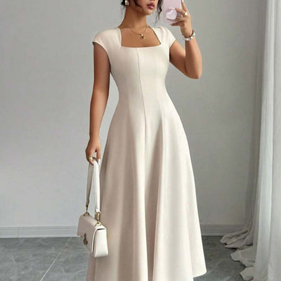 The Woman Is Wearing A Short-sleeved Casual Dress